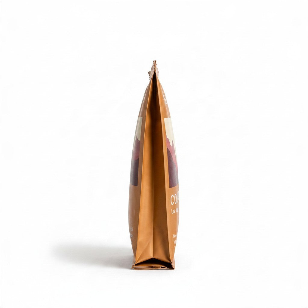 Lamora The Baristro Colombia Los Nogales specialty coffee drip bag in a brown side-profile pouch on a white background.