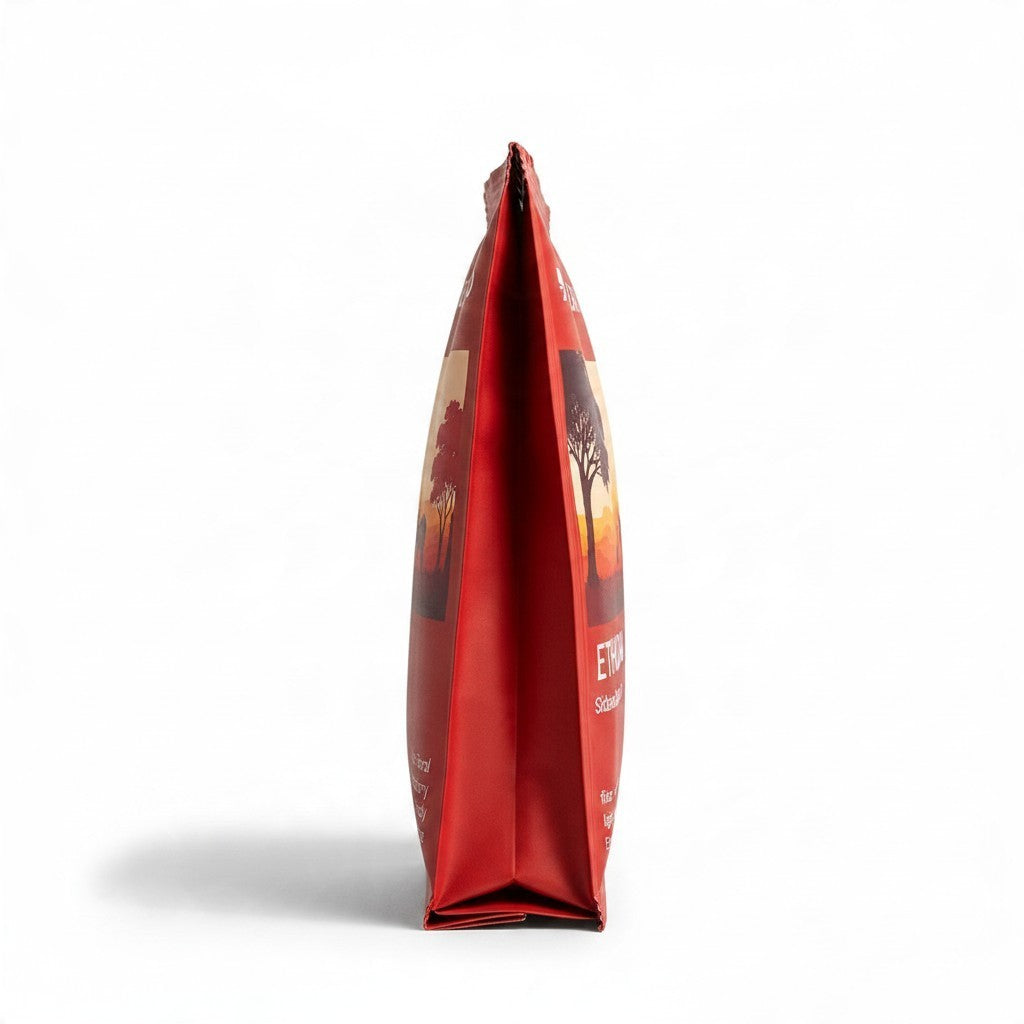 Lamora The Baristro Ethiopia Sidamo Bona Zuria drip coffee bag in red packaging with sunset landscape illustration