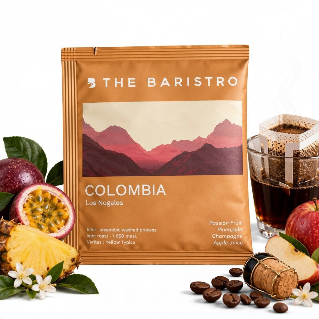 Lamora The Baristro Colombia Los Nogales specialty coffee drip bag with passion fruit, pineapple, and apple slices.