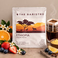 Lamora The Baristro Ethiopia Bweg Wu Natural coffee drip bag with orange, strawberry, and blueberry fruit accents.