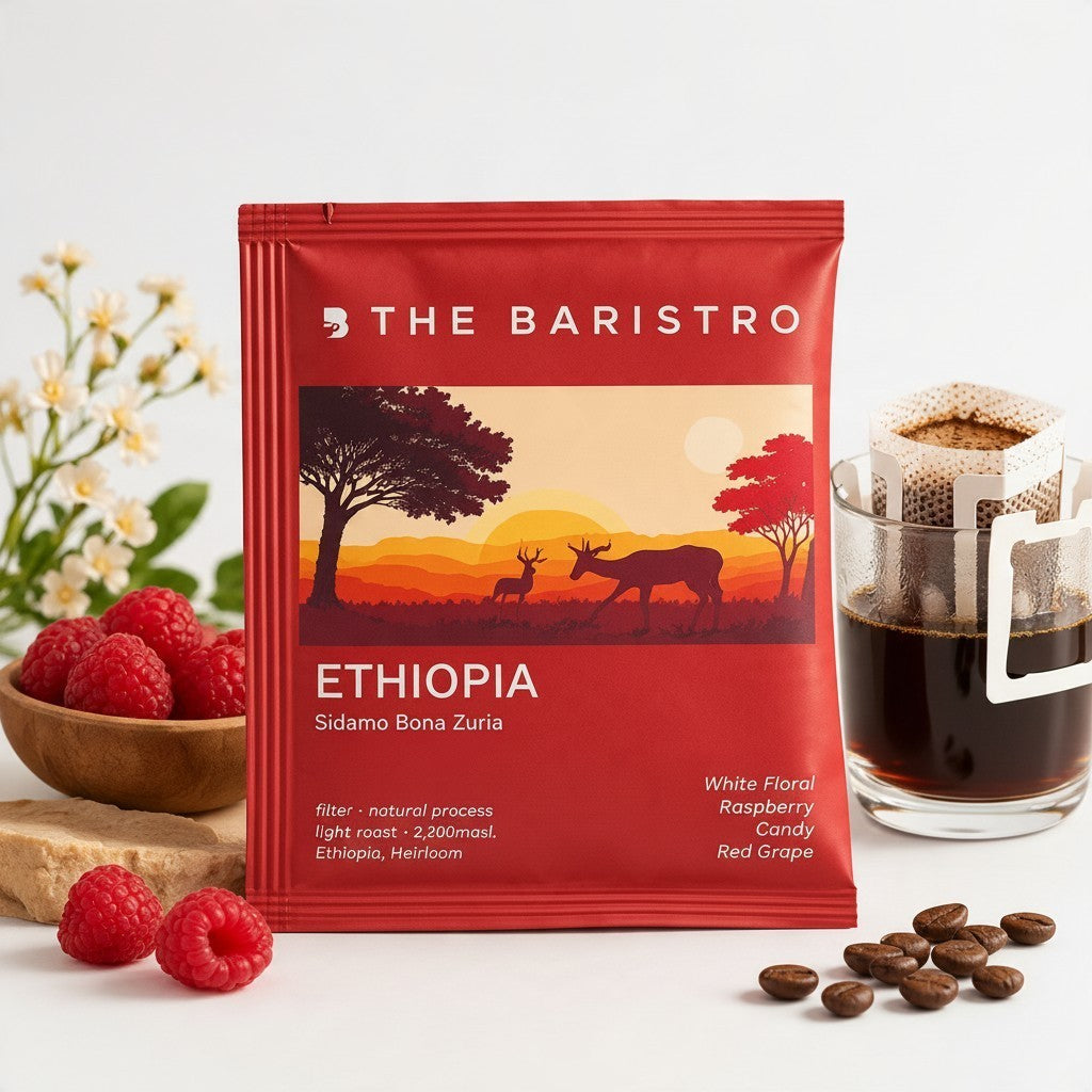 Lamora The Baristro Ethiopia Sidamo Bona Zuria drip coffee bag with raspberry, coffee beans, and a brewed cup.