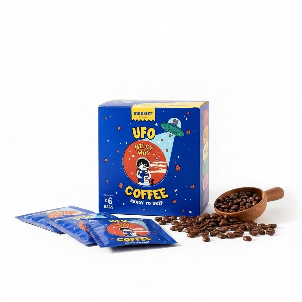 Lamora UFO Milky Way coffee box with six ready-to-drip sachets and a wooden scoop of roasted coffee beans